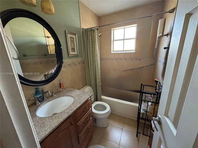 full bath featuring tile walls, toilet, shower / tub combo, vanity, and tile patterned flooring