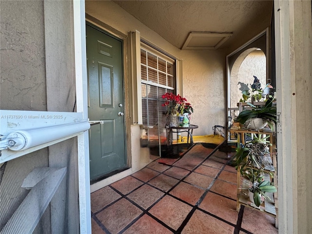 doorway to property with stucco siding