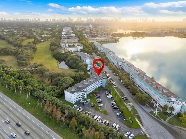 birds eye view of property featuring a water view