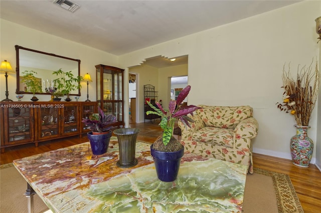 sitting room with dark hardwood / wood-style flooring