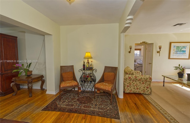 living area with hardwood / wood-style flooring