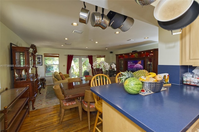 kitchen with dark hardwood / wood-style floors and light brown cabinetry