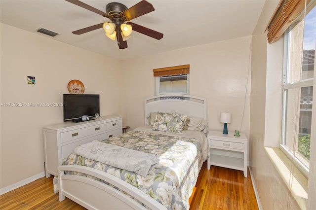 bedroom featuring hardwood / wood-style floors and ceiling fan