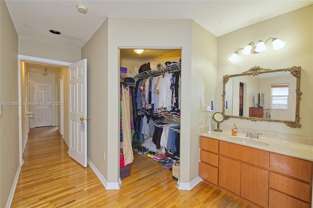 bathroom with vanity and hardwood / wood-style floors