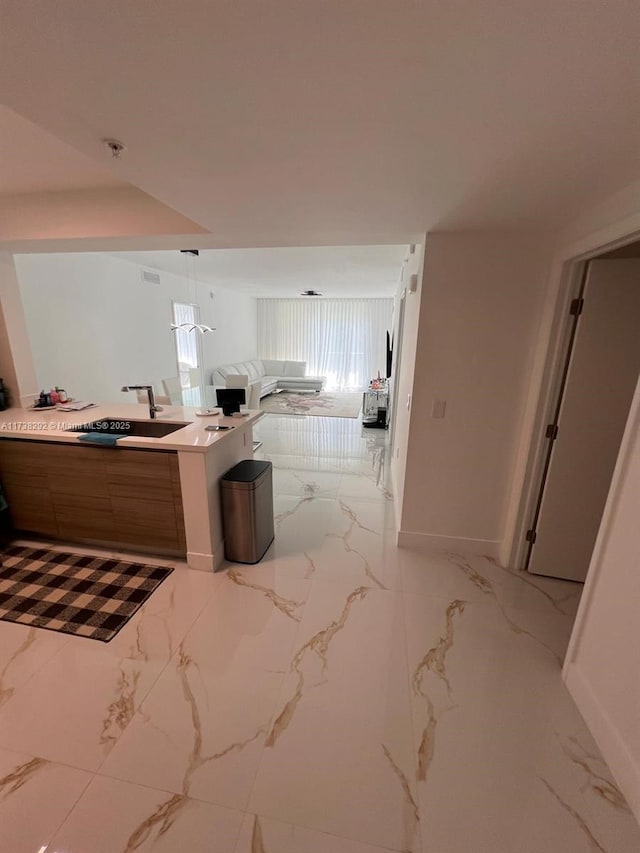 kitchen with sink and hanging light fixtures