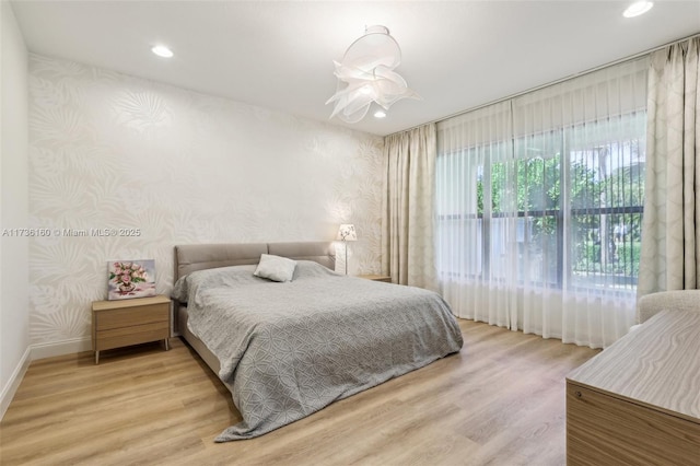 bedroom with hardwood / wood-style flooring