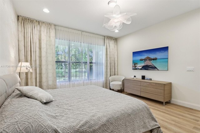 bedroom with wood-type flooring