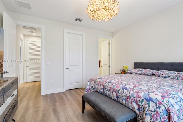 bedroom with light hardwood / wood-style flooring