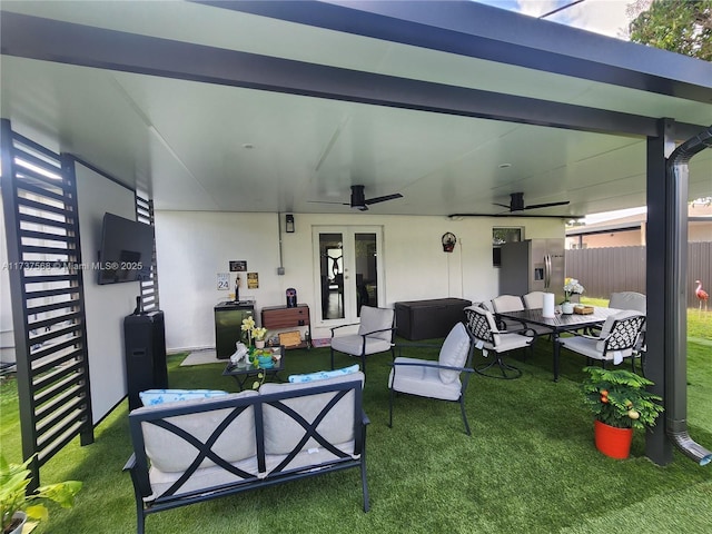 view of patio / terrace featuring an outdoor living space and ceiling fan