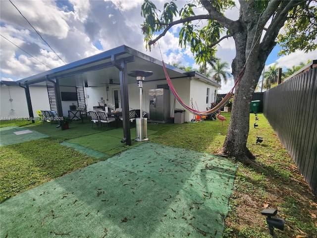 view of yard with ceiling fan