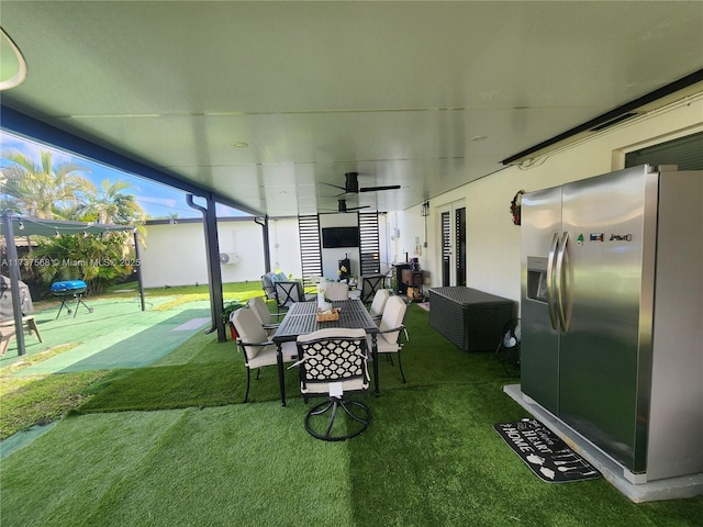 view of yard featuring ceiling fan