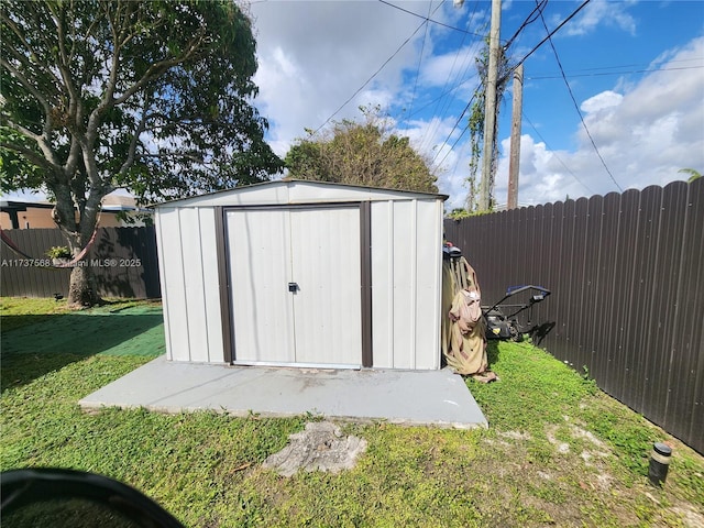 view of outdoor structure with a lawn