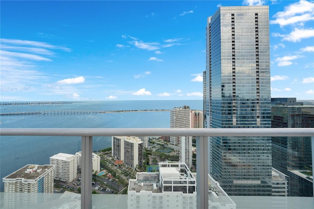 balcony featuring a water view