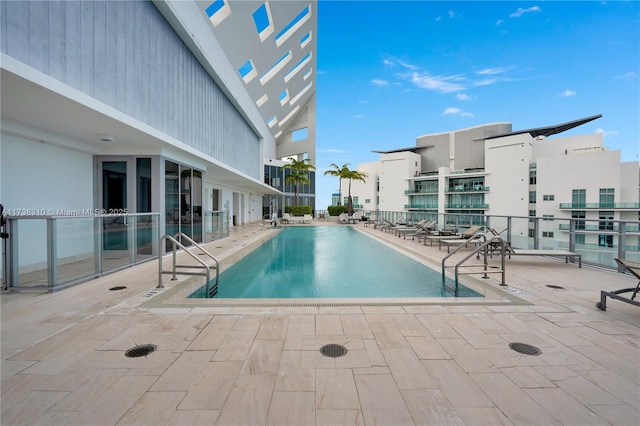 view of swimming pool featuring a patio