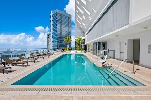 view of pool featuring a patio