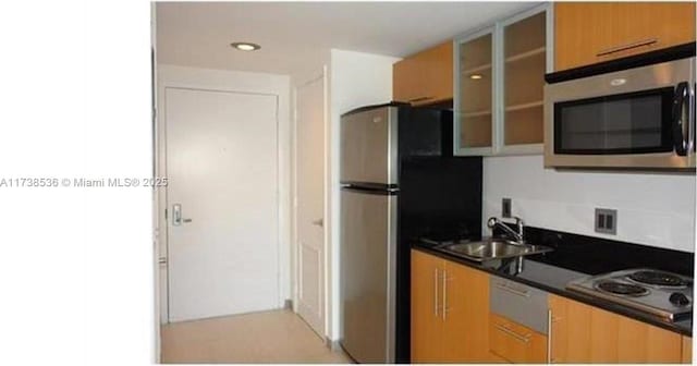 kitchen featuring appliances with stainless steel finishes and sink