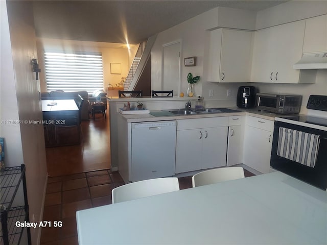 kitchen featuring under cabinet range hood, range with electric stovetop, a sink, white cabinetry, and dishwasher