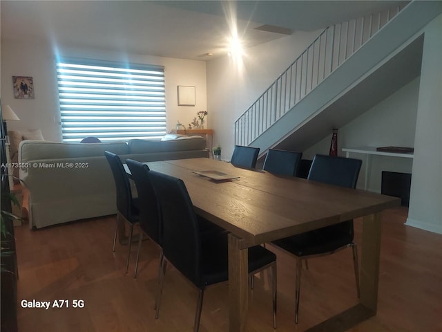 dining space featuring wood finished floors