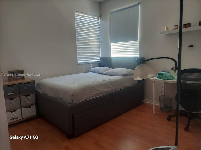 bedroom featuring wood finished floors