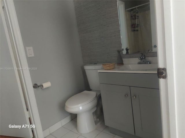 full bathroom with vanity, curtained shower, tile patterned flooring, and toilet