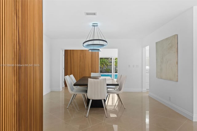 dining space with light tile patterned floors