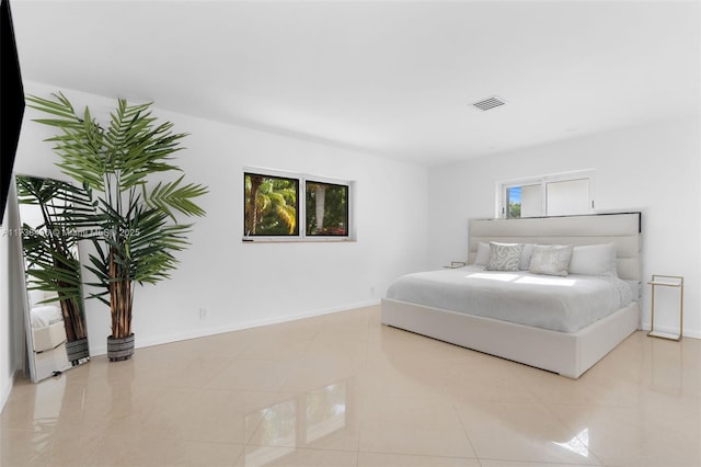 bedroom featuring light tile patterned floors