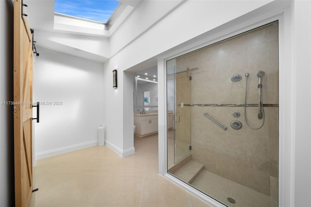 bathroom with tile patterned flooring, sink, and walk in shower