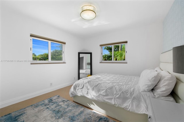 bedroom featuring multiple windows