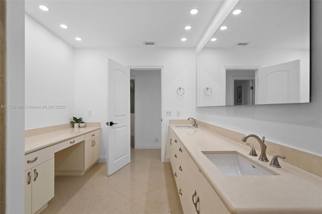 bathroom with tile patterned floors and vanity