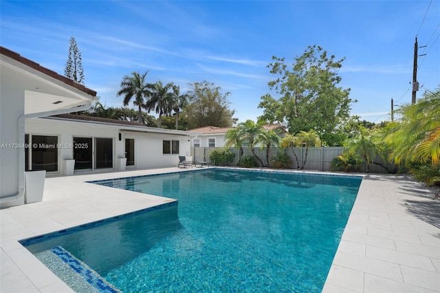 view of swimming pool with a patio area