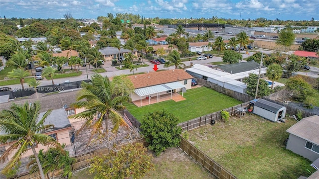 birds eye view of property with a residential view