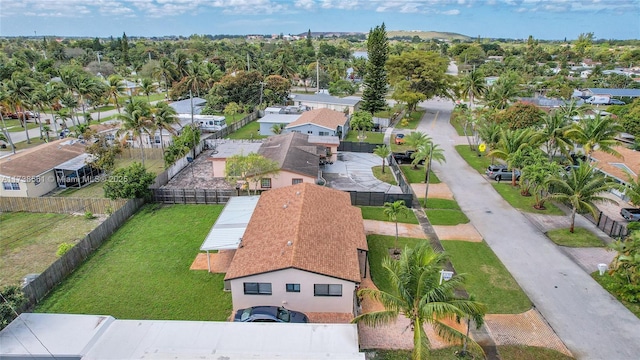 birds eye view of property with a residential view