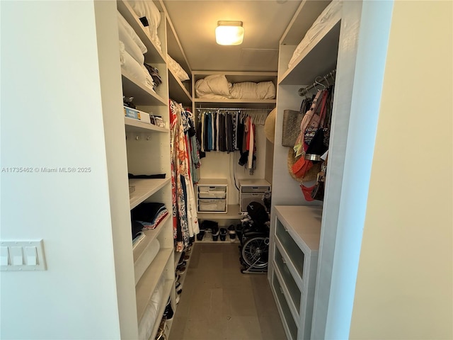 spacious closet featuring hardwood / wood-style flooring