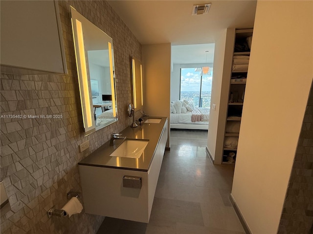 bathroom with vanity and backsplash