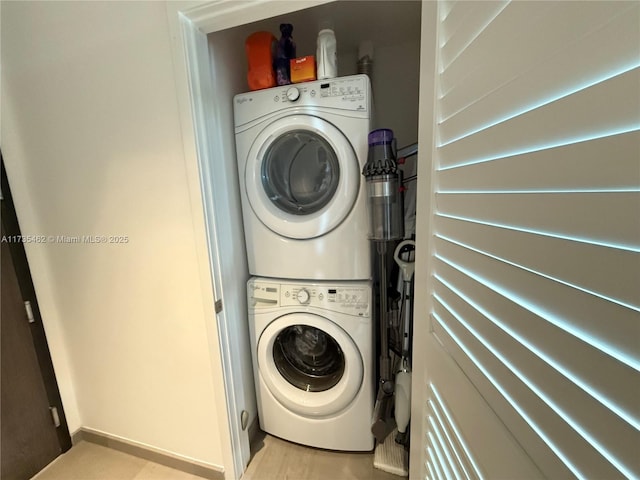 laundry room with stacked washer and clothes dryer