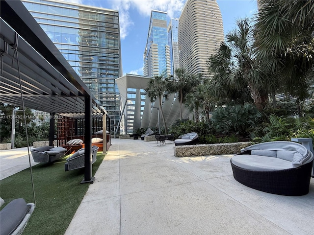 view of home's community featuring a pergola and a patio area