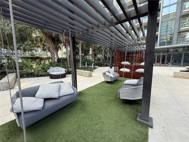 view of patio with an outdoor living space and a pergola