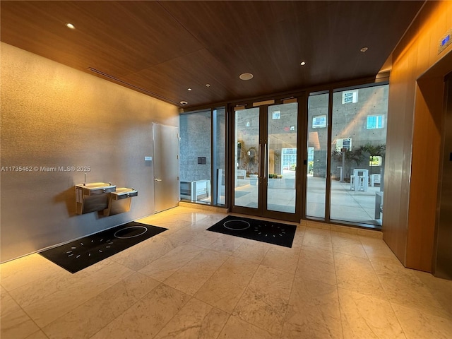 interior space featuring floor to ceiling windows and wood ceiling