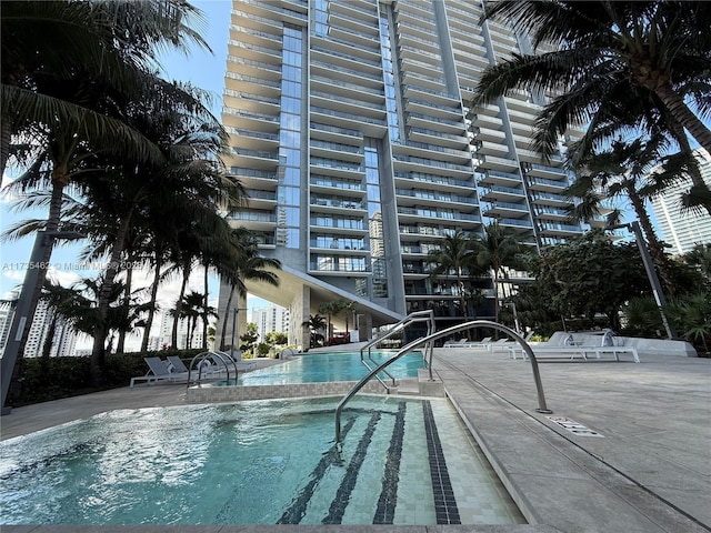 view of swimming pool with a patio area