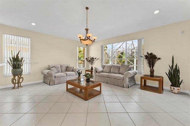 living room with a chandelier and light tile patterned floors