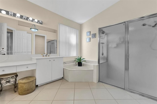 bathroom with tile patterned floors, plus walk in shower, and vanity