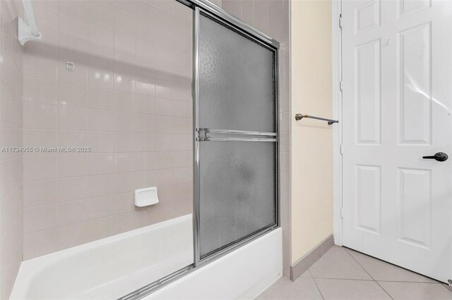 bathroom with tile patterned flooring and enclosed tub / shower combo