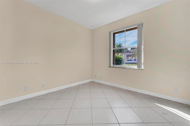 spare room with light tile patterned floors