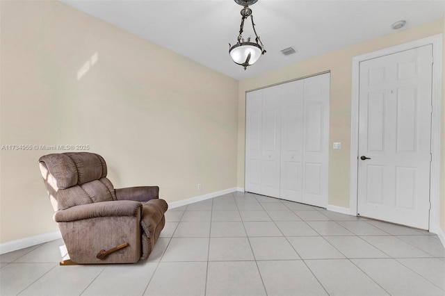 living area featuring light tile patterned flooring