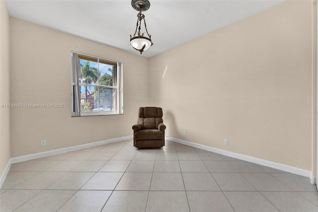 unfurnished room featuring light tile patterned flooring