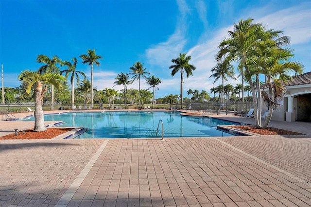 view of swimming pool with a patio area