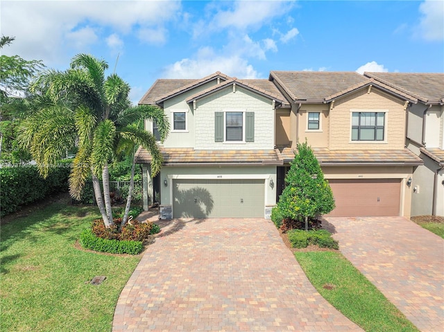 view of front of house featuring a garage and a front yard