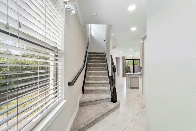 stairs featuring tile patterned floors