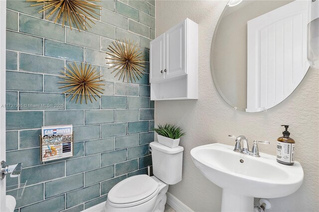 bathroom featuring sink and toilet