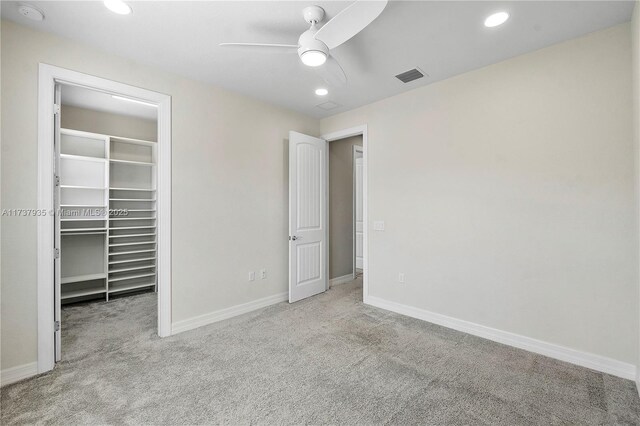 walk in closet with carpet floors